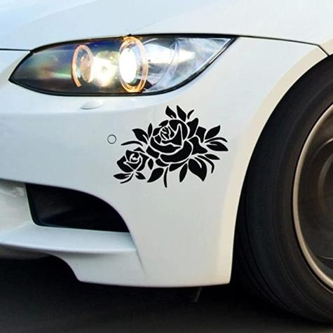 Covering vehicle damage with stickers